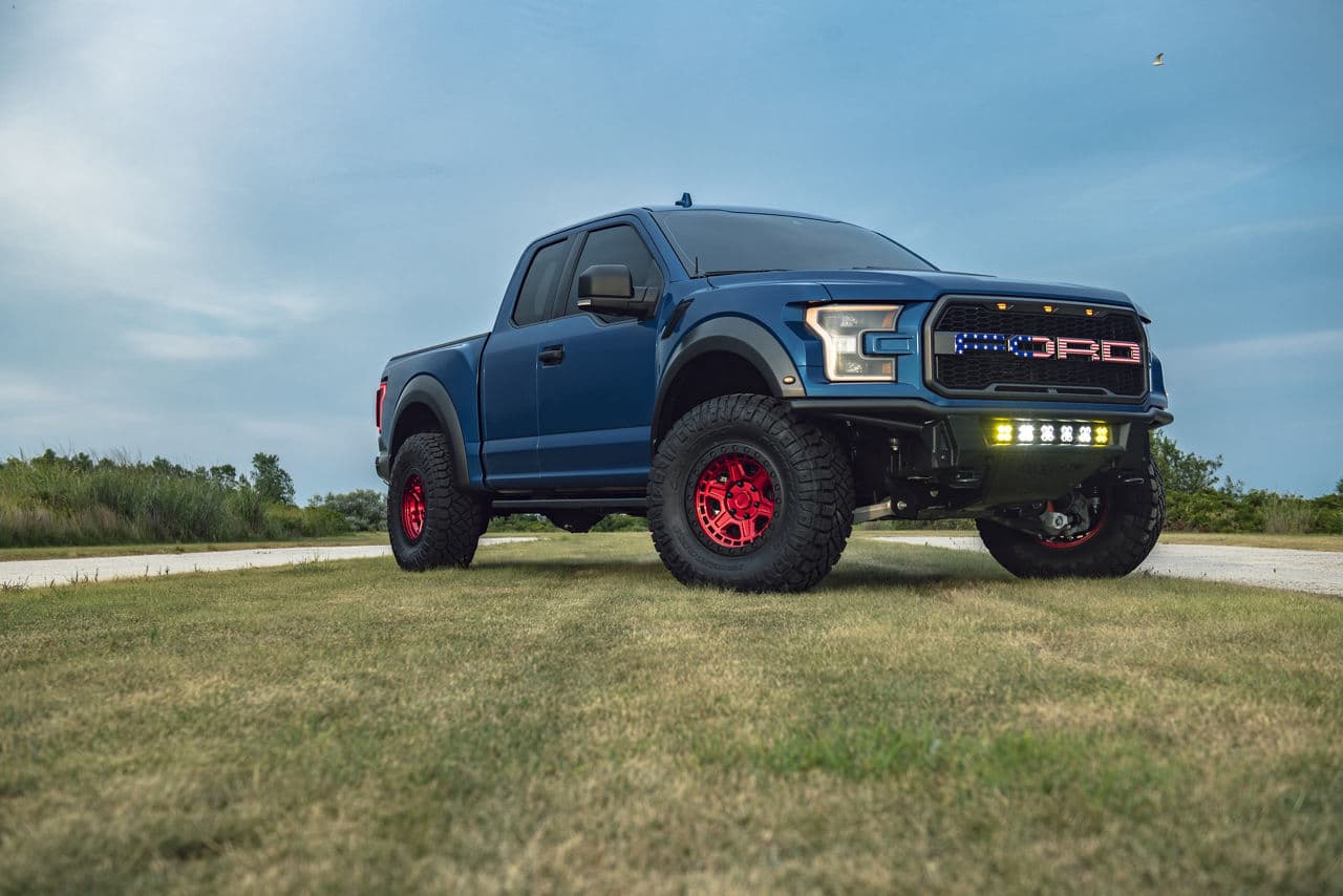 Front view of 2019 Ford F150 Raptor with truck suv wheels