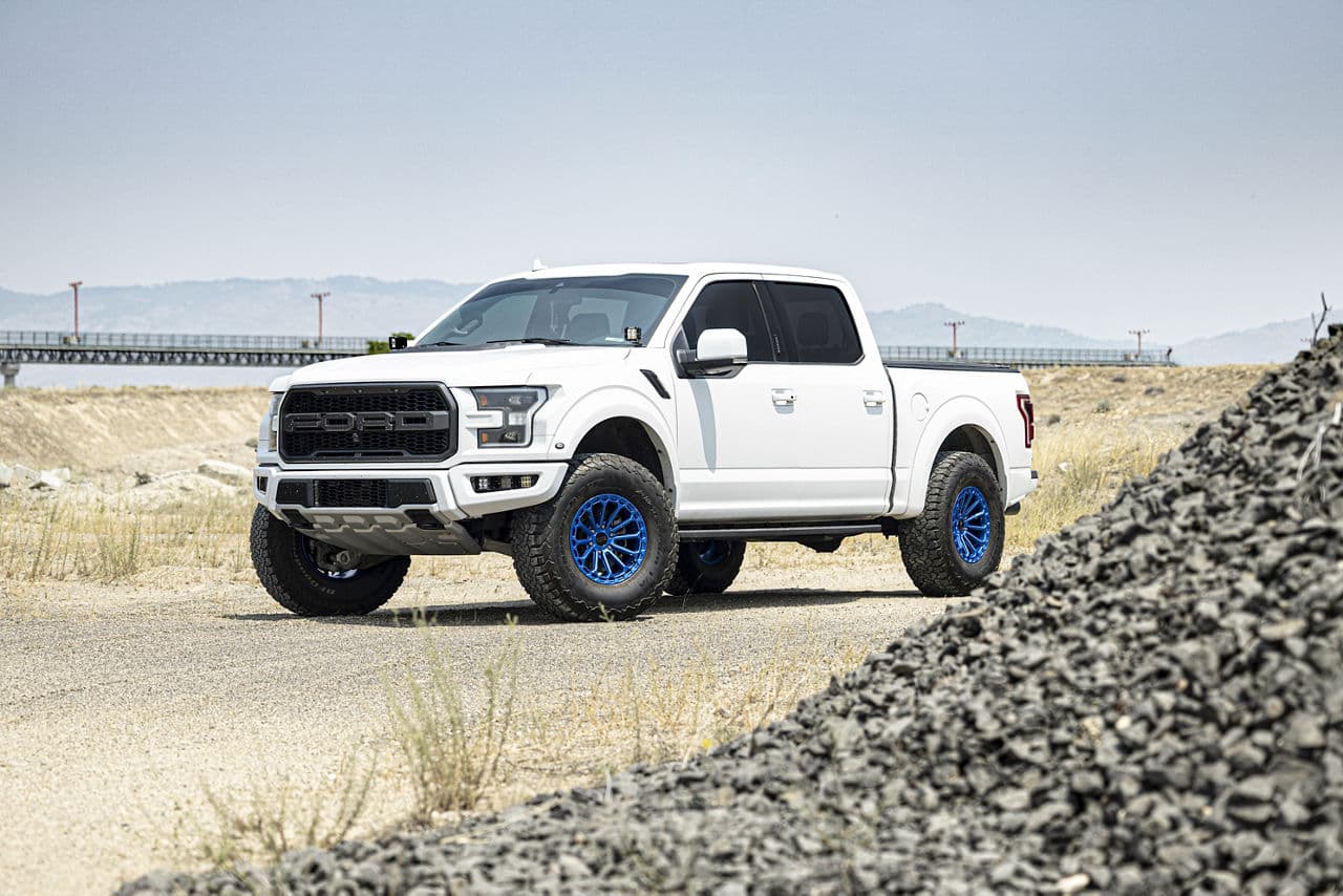 Front view of 2019 Ford F150 Raptor with vehicle wraps