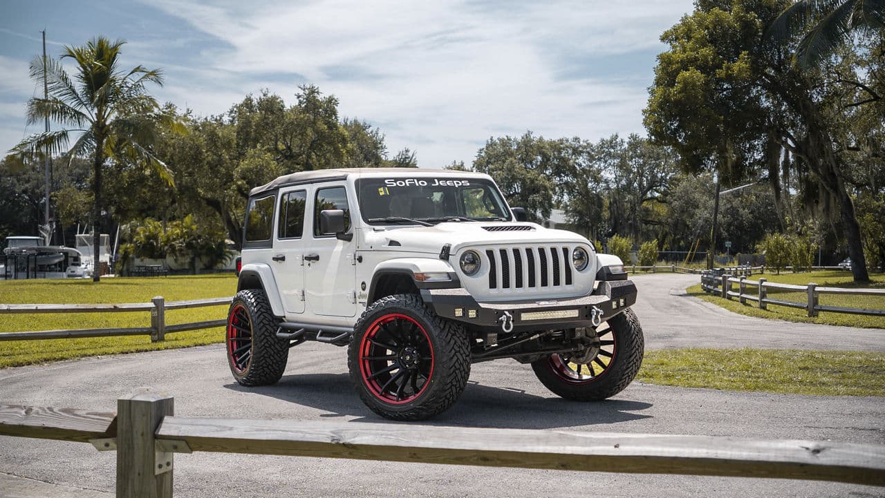 Side profile of 2019 Jeep Wrangler Unlimited Sport with wheels