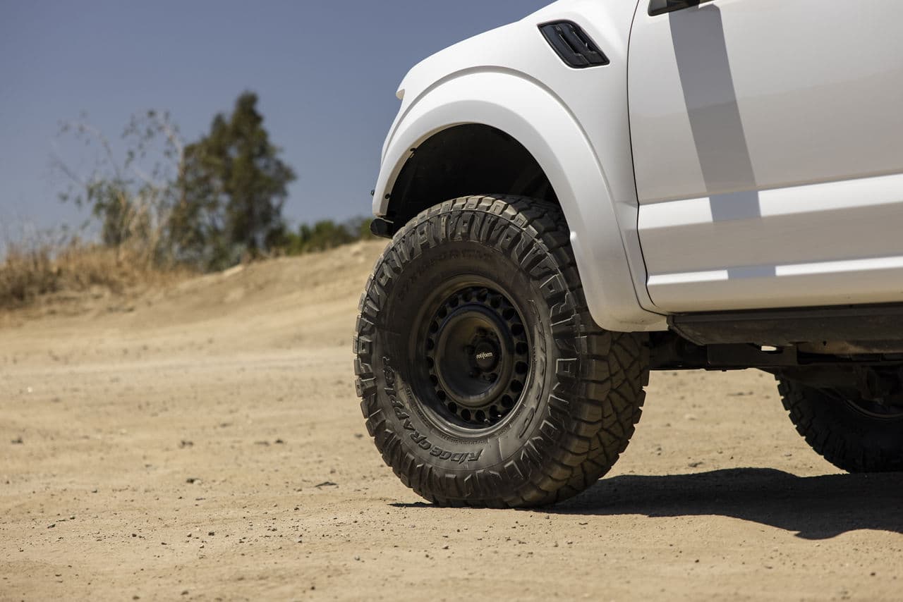 Side profile of 2020 Ford F150 Raptor with truck suv wheels