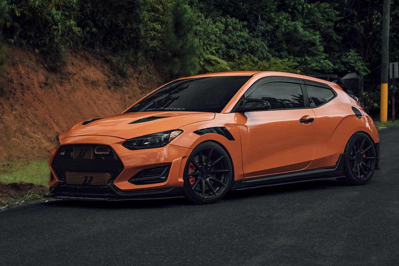 Side profile of 2020 Hyundai Veloster with tuner wheels