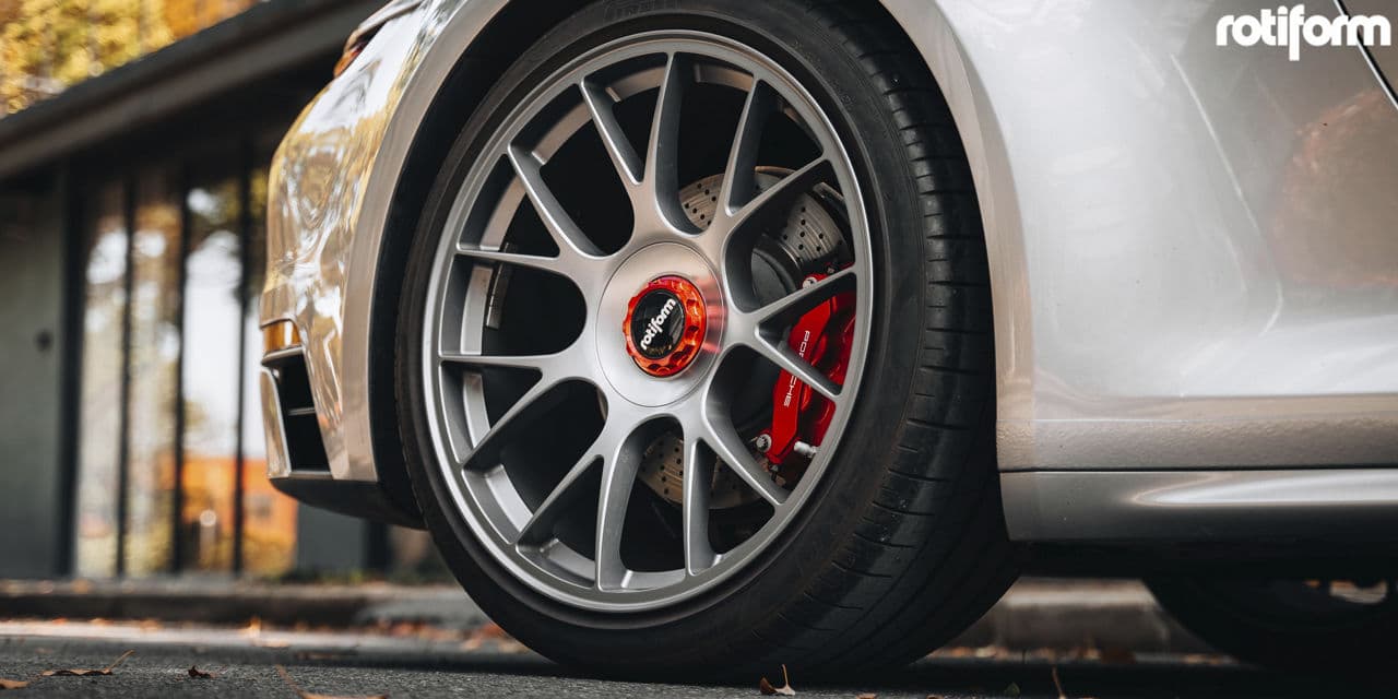 Rear view of 2020 Porsche 911 with wheels