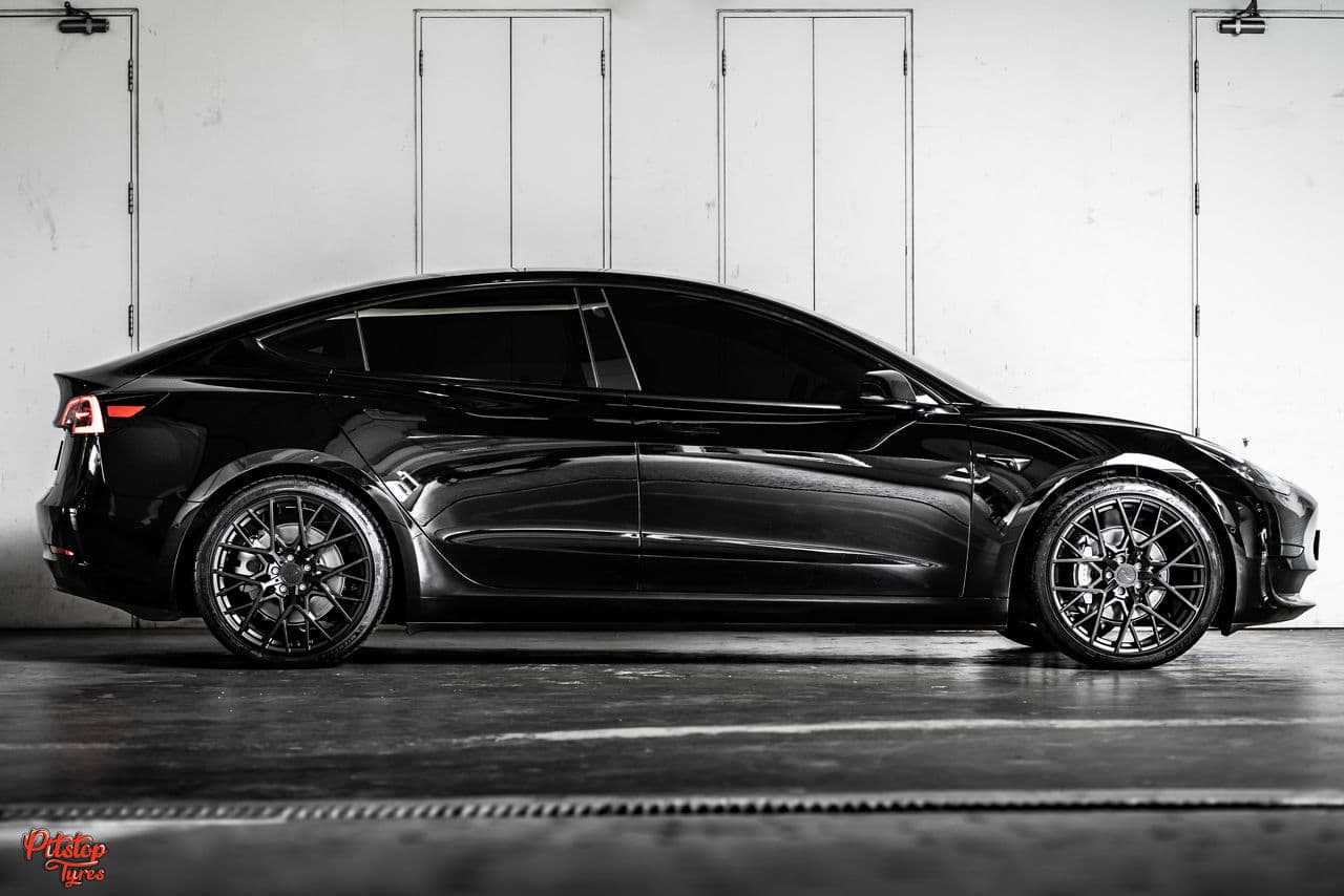 Side profile of 2020 Tesla Model 3 with wheels
