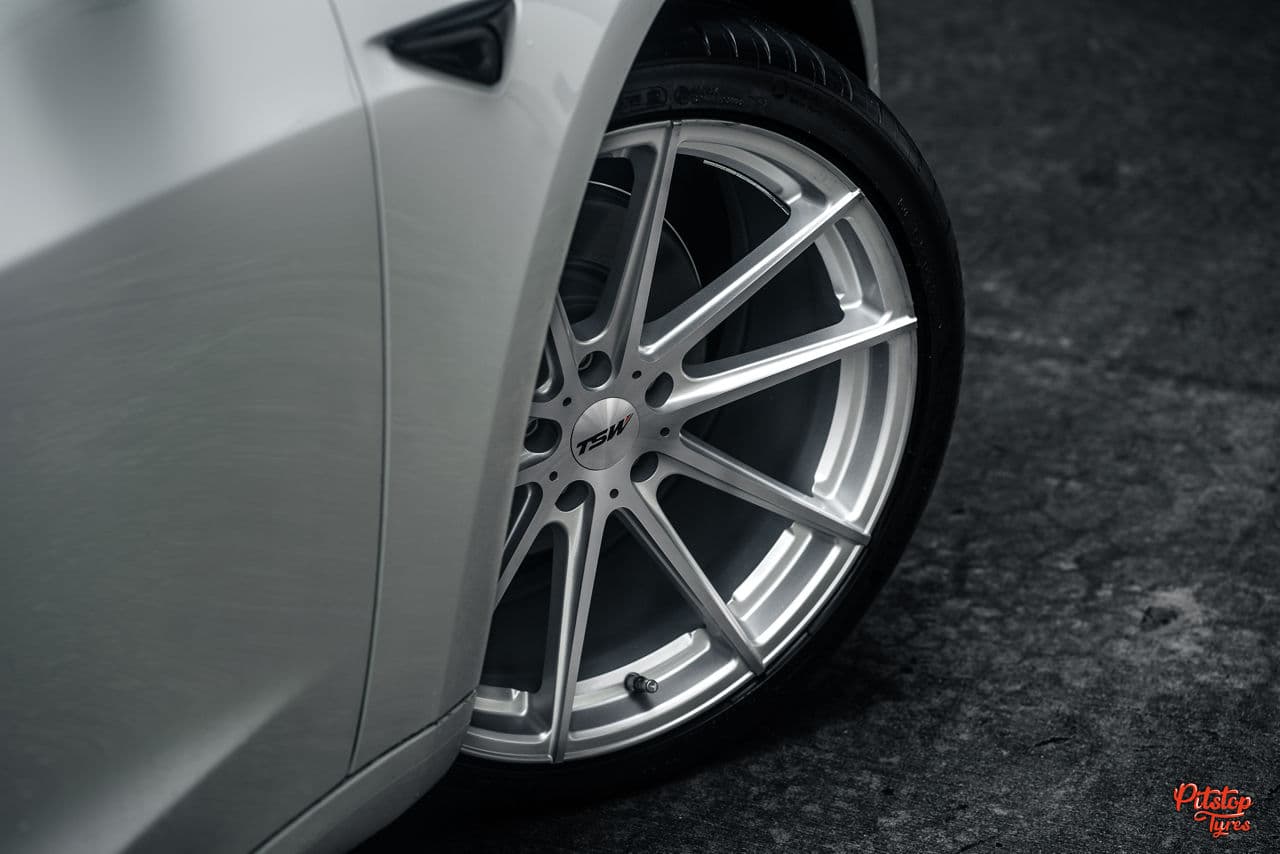 Side profile of 2020 Tesla Model 3 with wheels
