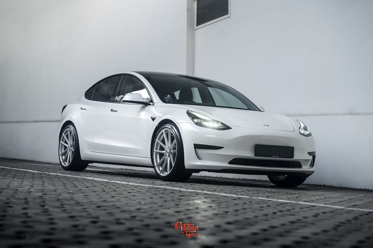Rear view of 2020 Tesla Model 3 with wheels