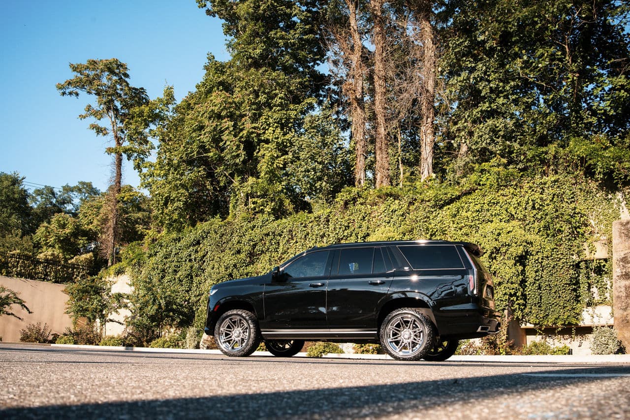 Rear view of 2021 Cadillac Escalade with wheels
