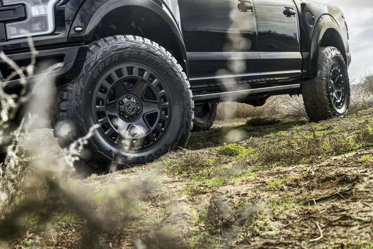 Rear view of 2021 Ford F150 Raptor with truck suv wheels