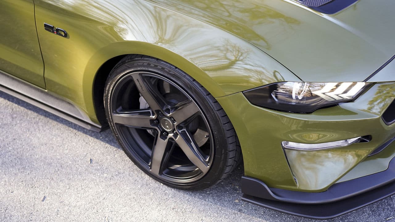 Rear view of 2021 Ford Mustang with wheels