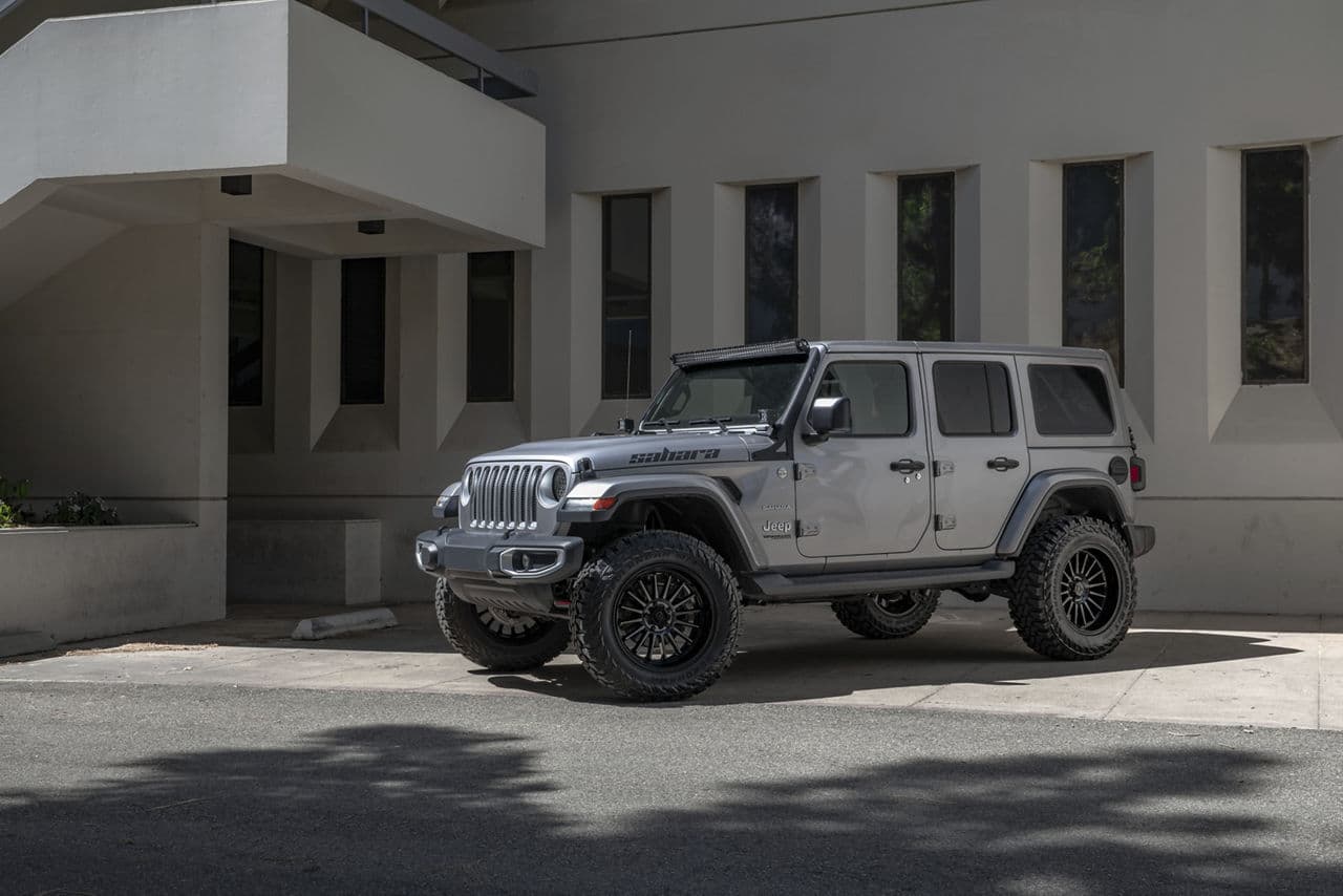 Front view of 2021 Jeep Wrangler Sahara with truck suv wheels