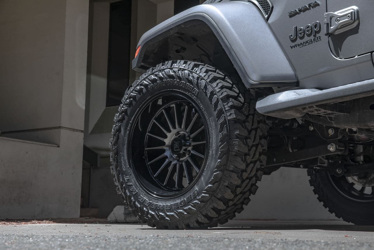 Side profile of 2021 Jeep Wrangler Sahara with truck suv wheels