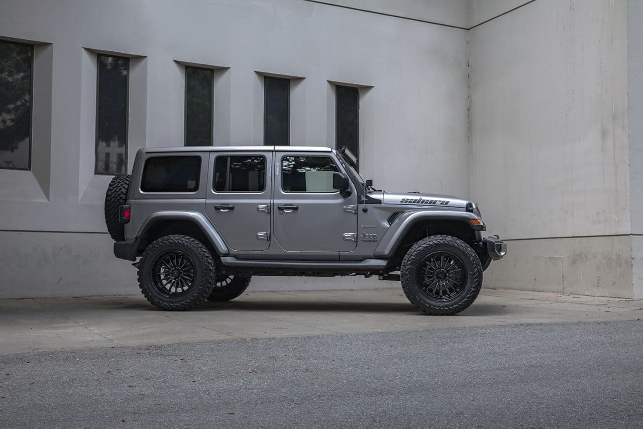 Rear view of 2021 Jeep Wrangler Sahara with truck suv wheels