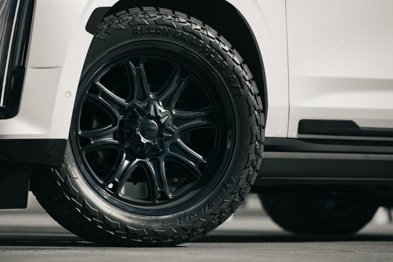 Detail view of 2022 Cadillac Escalade with truck suv wheels