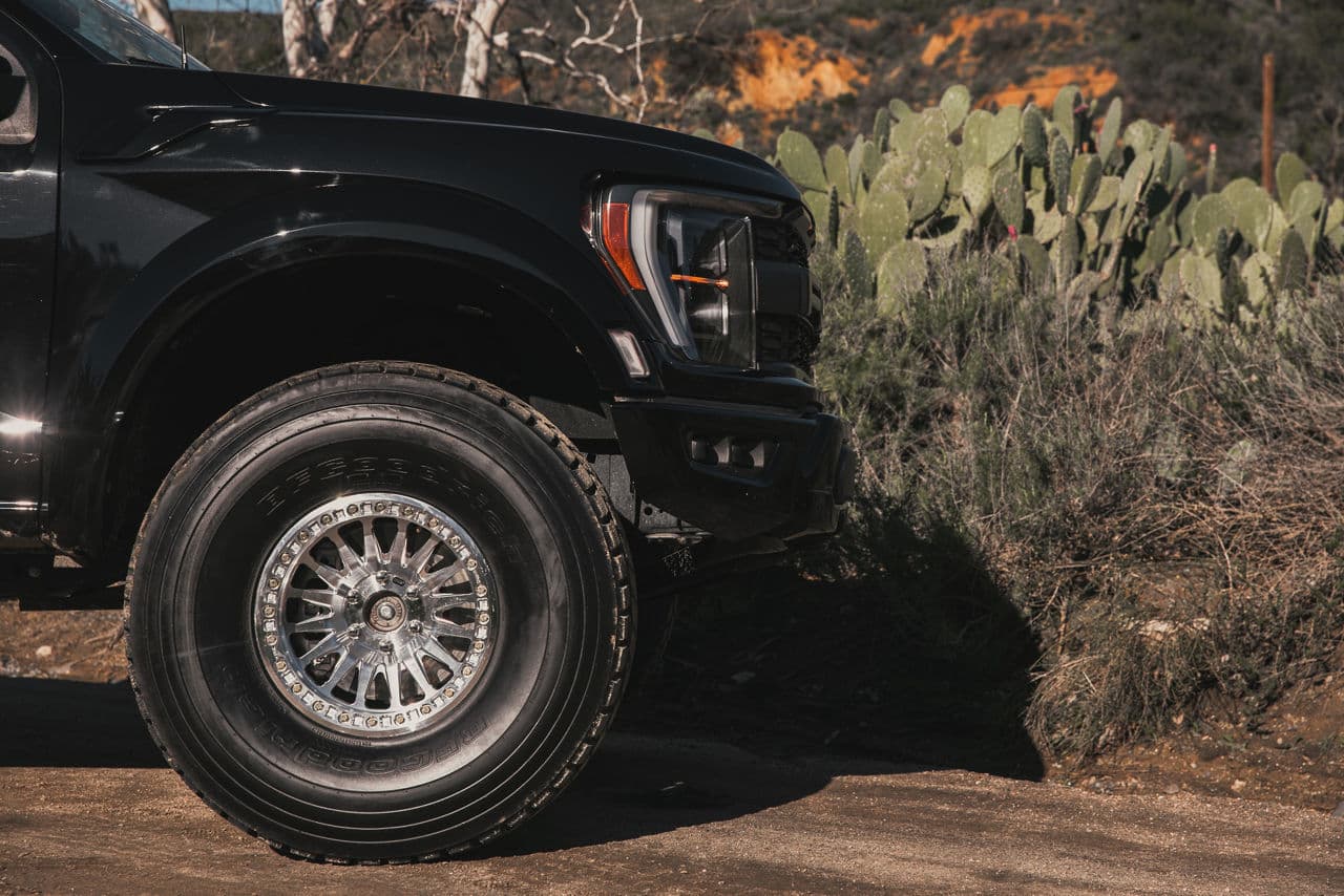 Rear view of 2022 Ford F150 Raptor with truck suv wheels