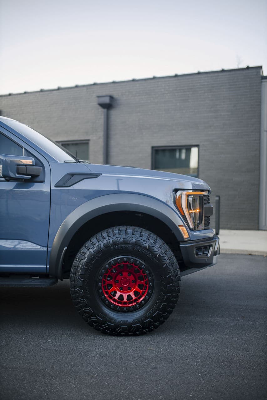 Rear view of 2022 Ford F150 Raptor with truck suv wheels