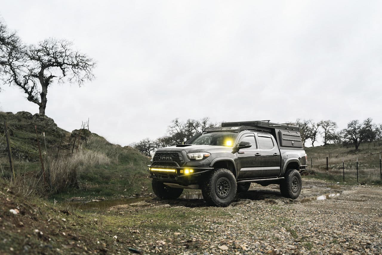 Rear view of 2022 Toyota Tacoma with vehicle wraps