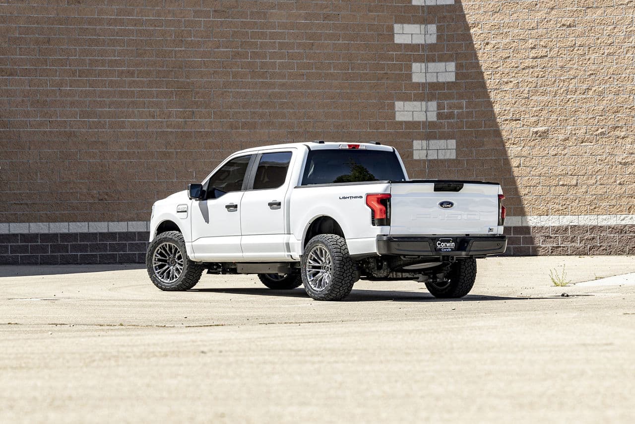 Side profile of 2023 Ford F150 Lightning with wheels