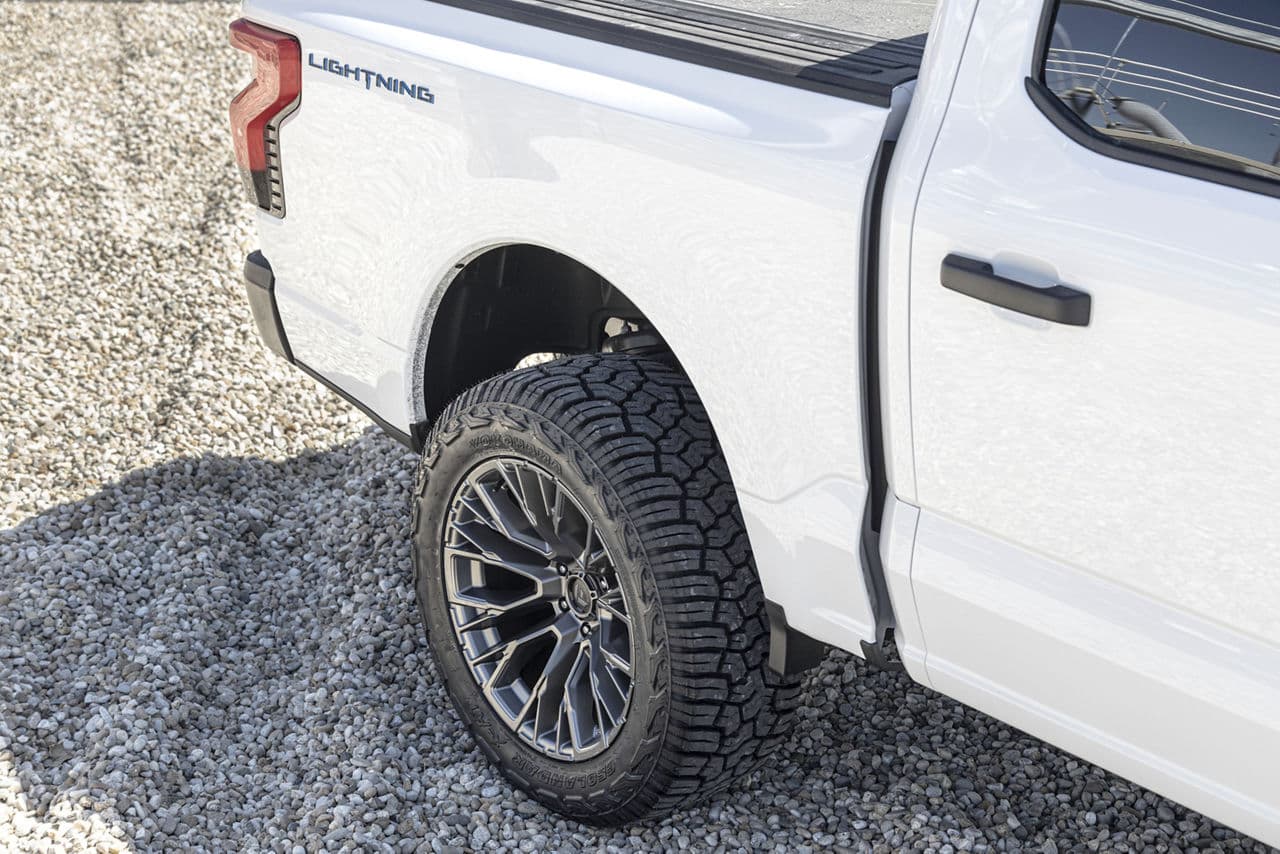 Rear view of 2023 Ford F150 Lightning with wheels