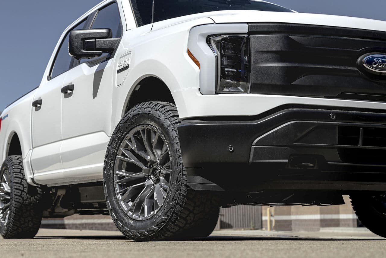 Detail view of 2023 Ford F150 Lightning with wheels