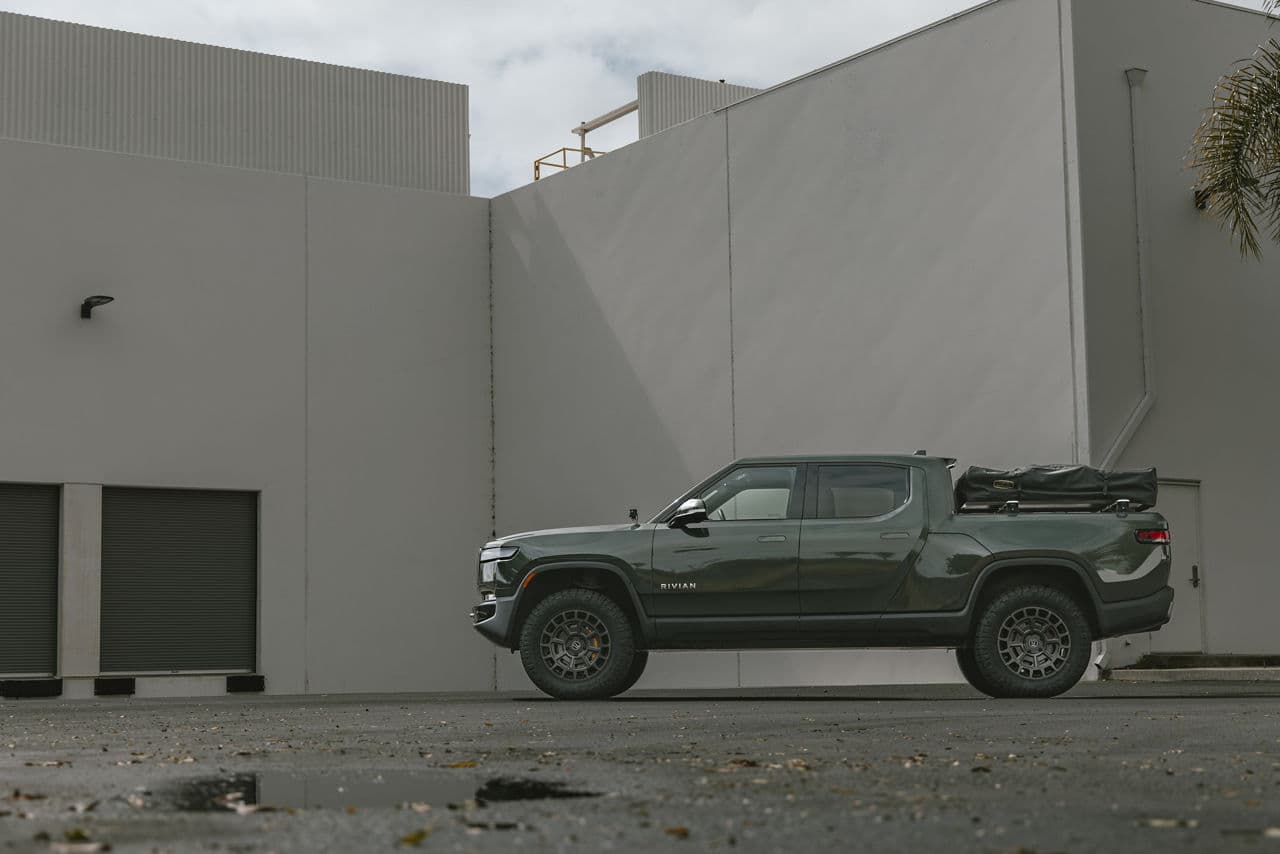Side profile of 2023 Rivian R1T with wheels