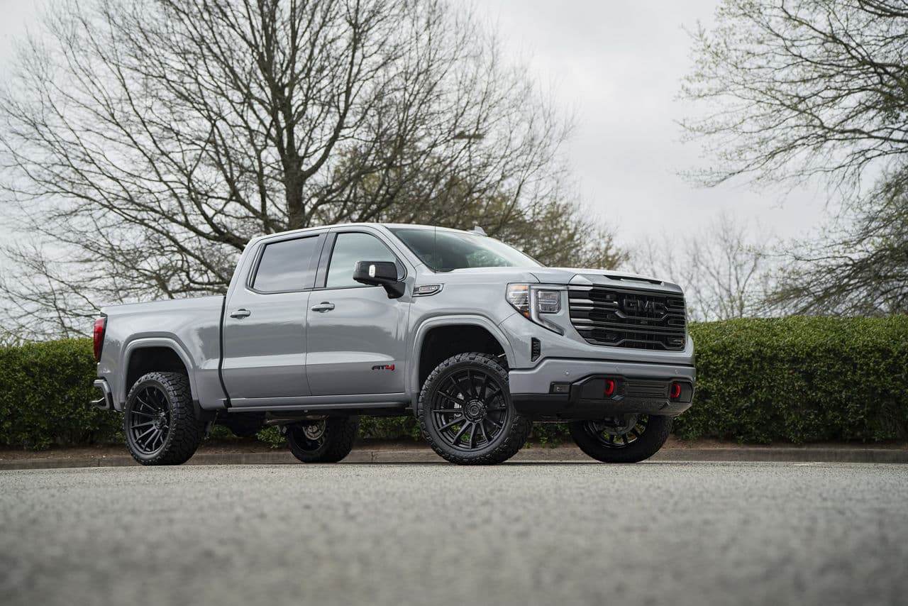 Front view of 2024 GMC Sierra 1500 AT4 with truck suv wheels