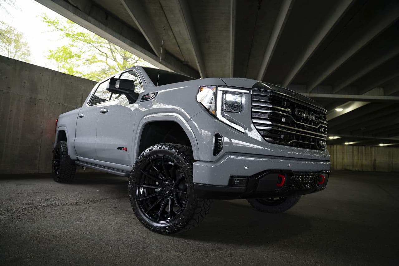 Rear view of 2024 GMC Sierra 1500 AT4 with truck suv wheels