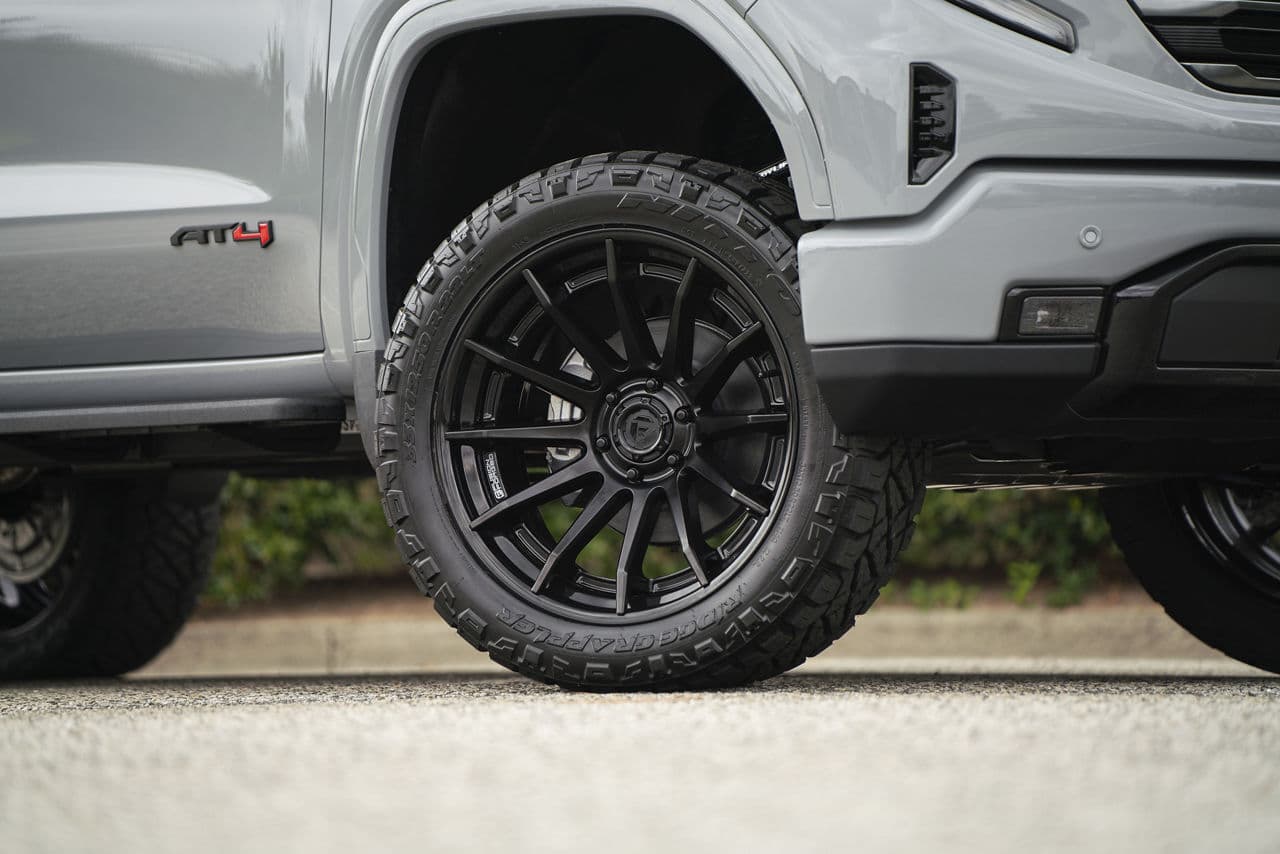Detail view of 2024 GMC Sierra 1500 AT4 with truck suv wheels