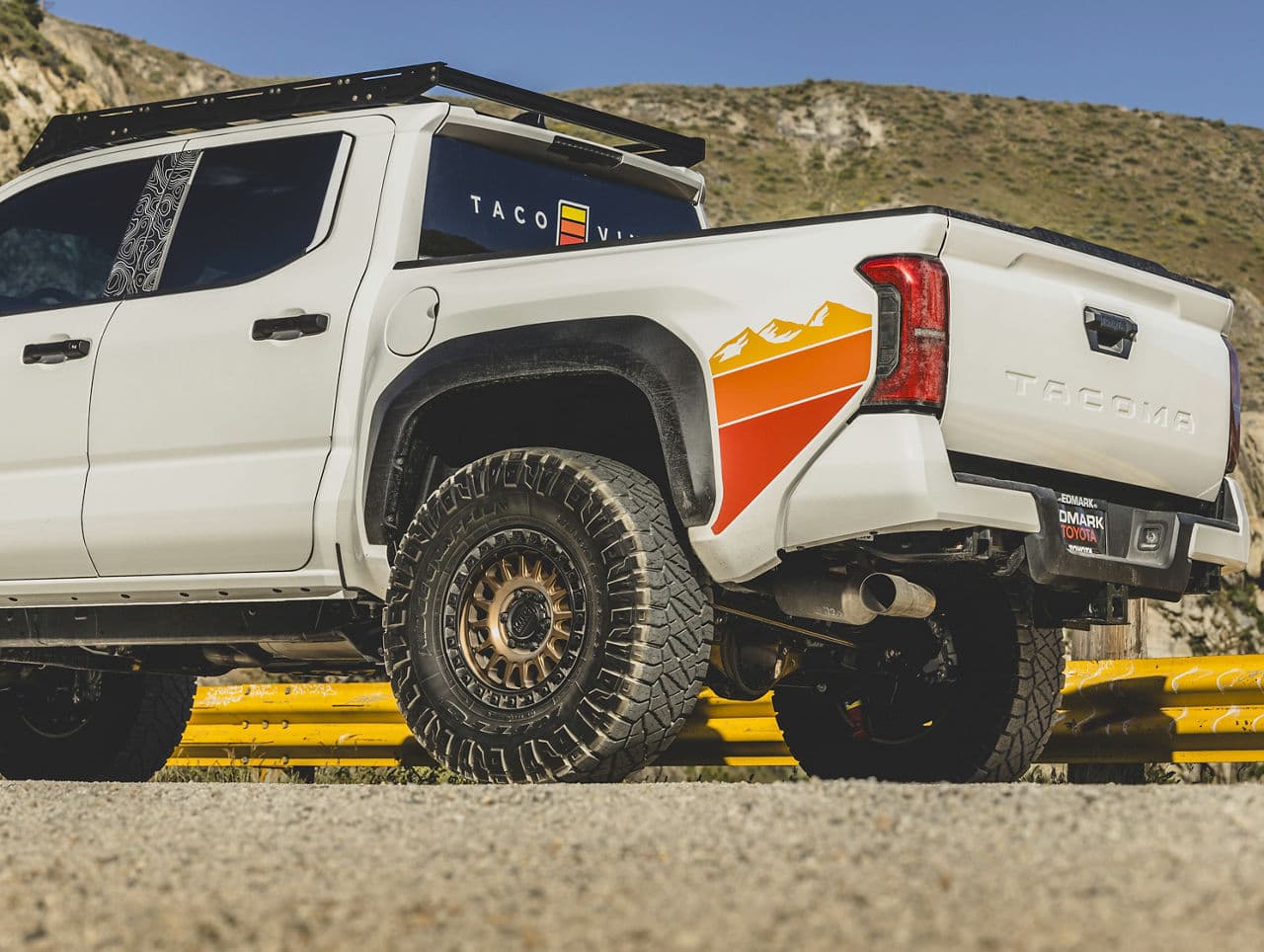 Side profile of 2024 Toyota Tacoma with wheels