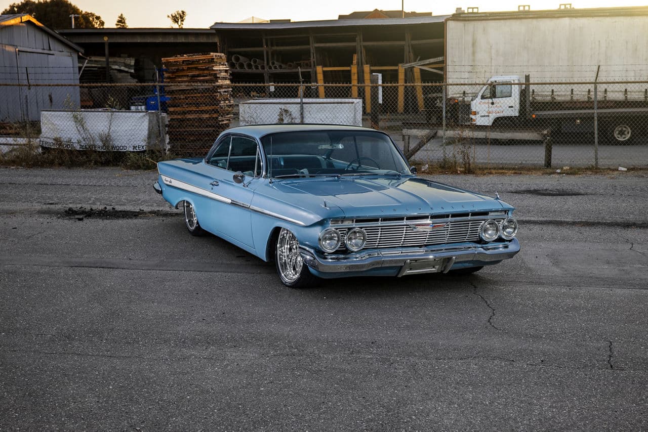 Side profile of 1961 Chevrolet Impala with wheels