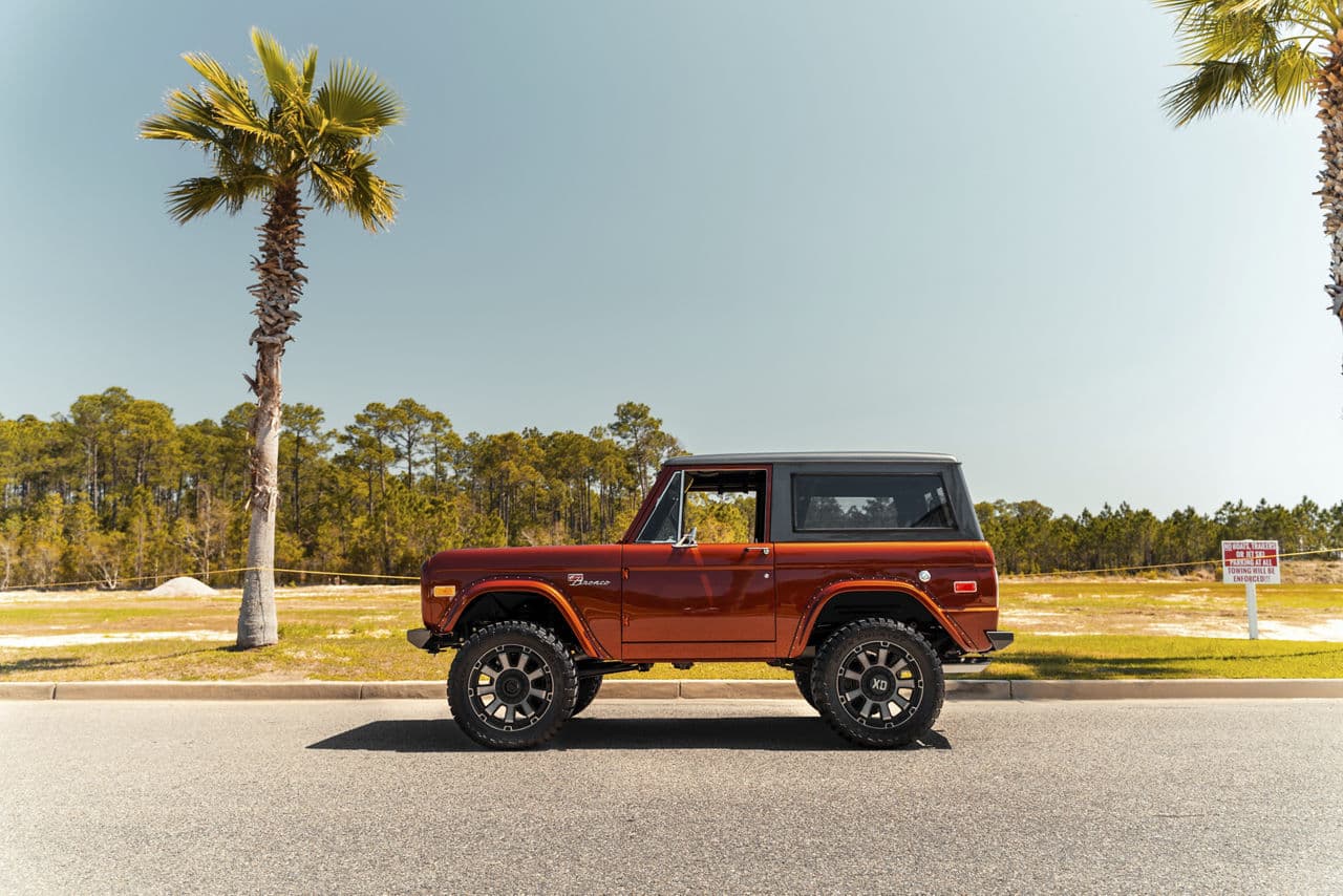 Side profile of 1975 Ford Bronco with wheels