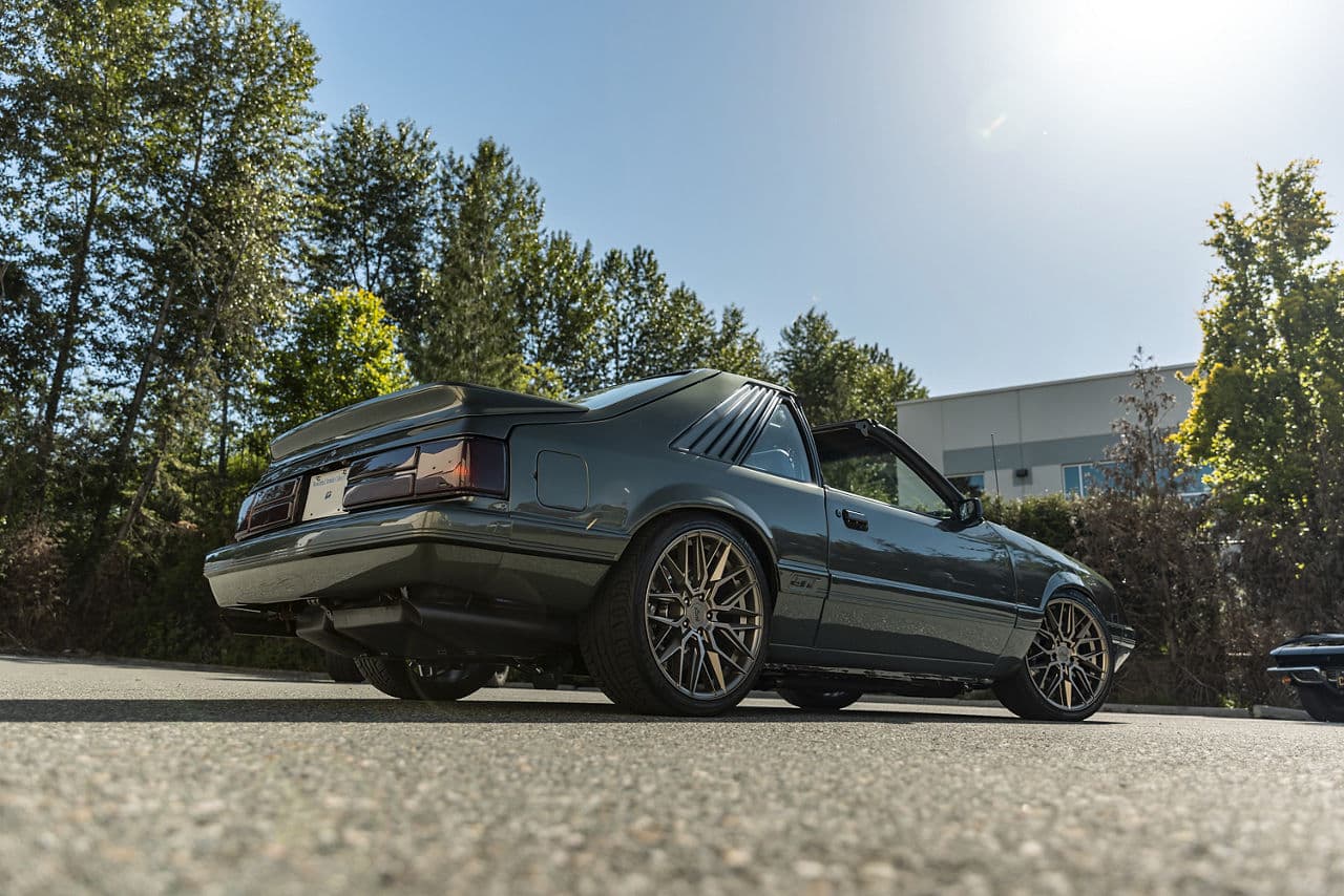Side profile of 1985 Ford Mustang with wheels