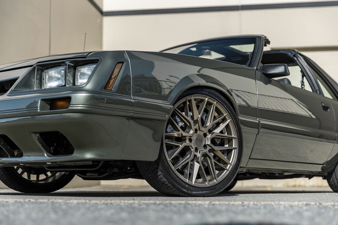 Rear view of 1985 Ford Mustang with wheels
