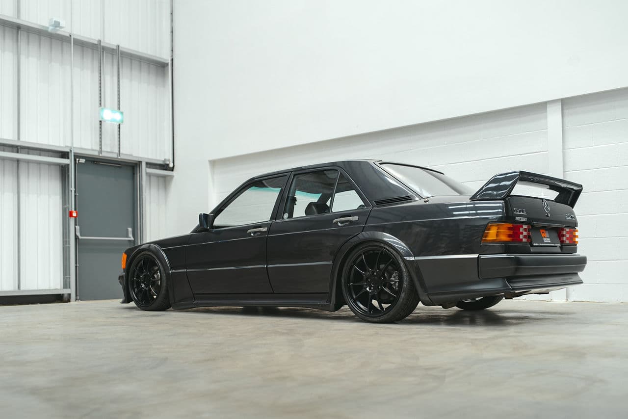 Side profile of 1986 Mercedes-Benz 190e with wheels