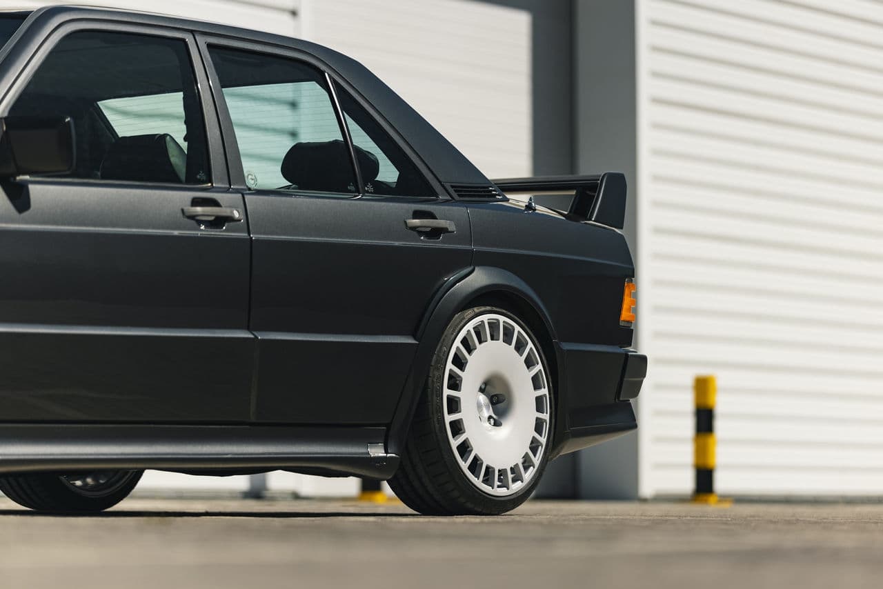 Side profile of 1986 Mercedes-Benz 190e with wheels