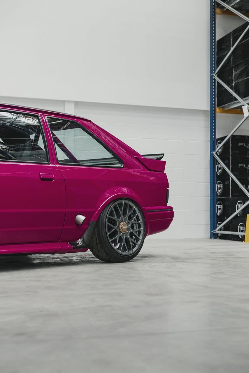 Side profile of 1990 Ford Escort with wheels