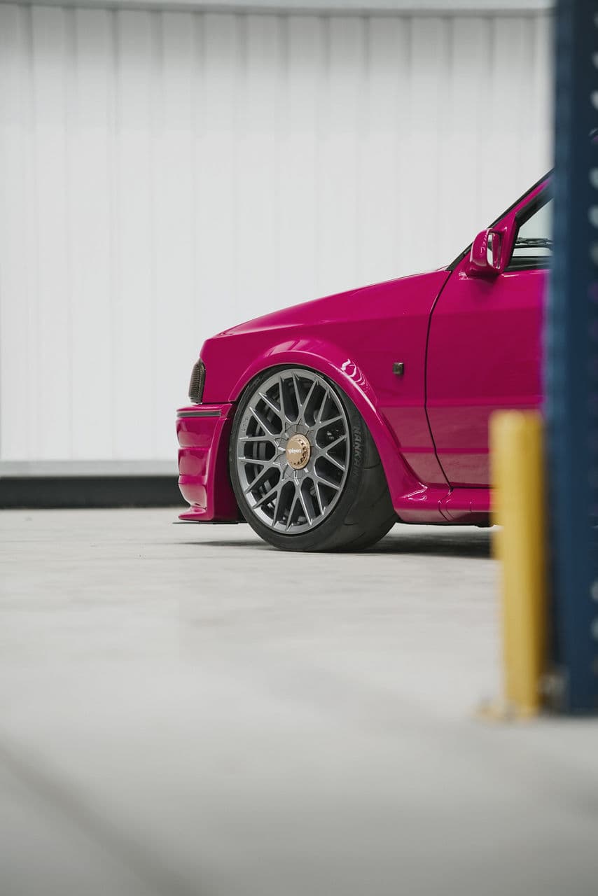 Rear view of 1990 Ford Escort with wheels