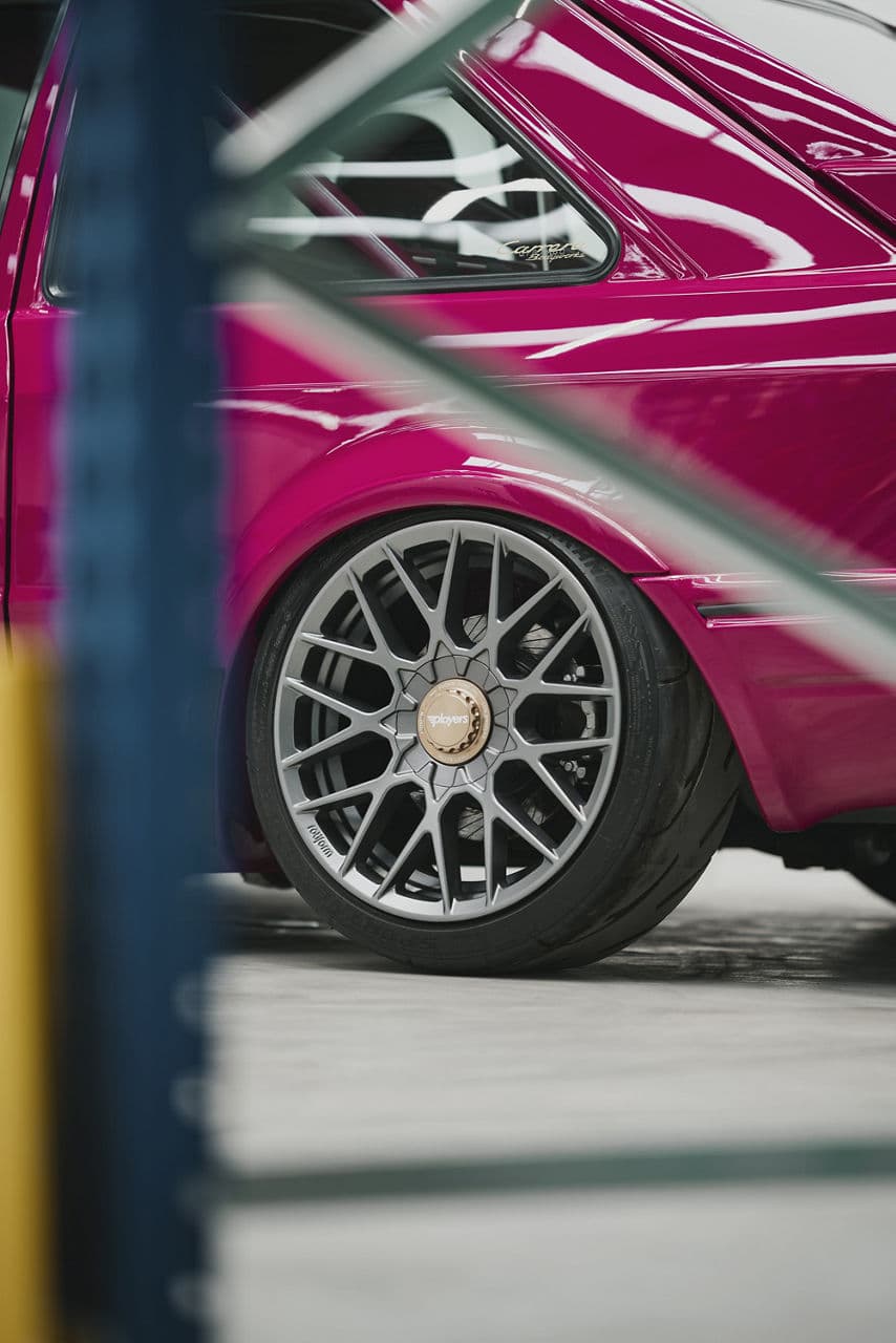 Detail view of 1990 Ford Escort with wheels