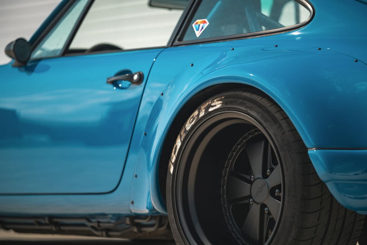 Rear view of 1990 Porsche 911 RWB with wheels