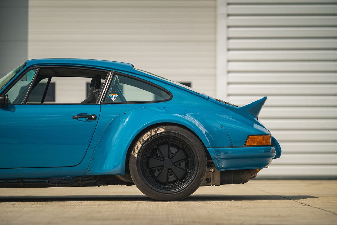 Detail view of 1990 Porsche 911 RWB with wheels