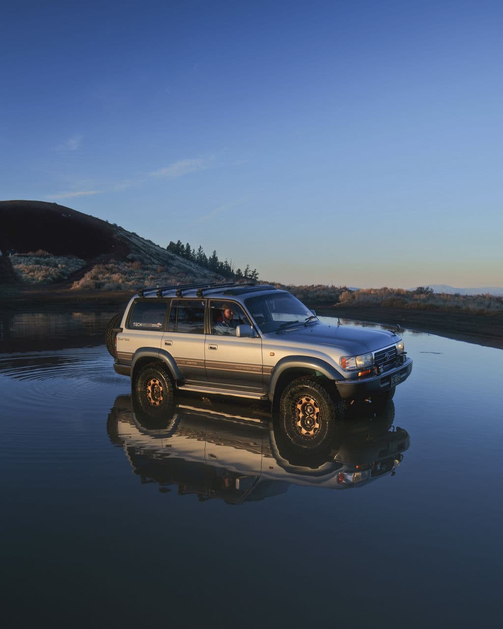 Side profile of 1990 Toyota Land Cruiser with truck suv wheels