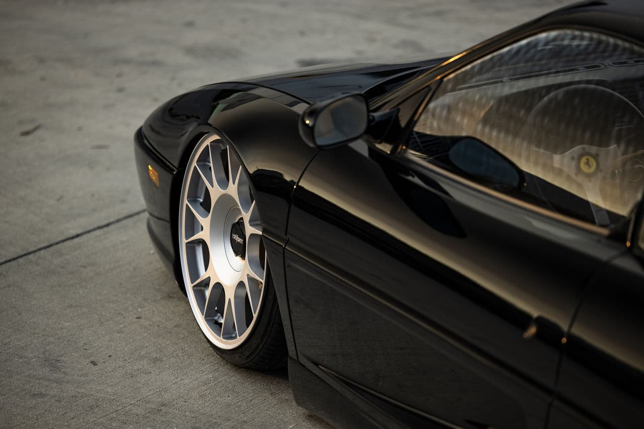 Side profile of 1995 Ferrari F355 with wheels