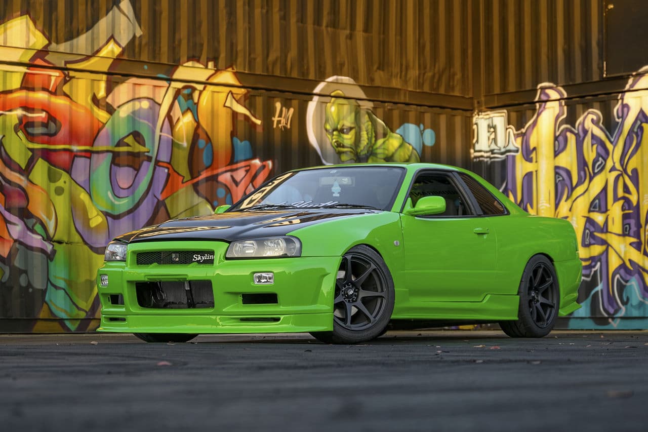 Front view of 1995 Nissan R34 Skyline with tuner wheels