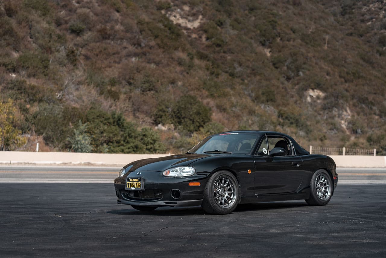 Side profile of 2002 Mazda Miata with wheels