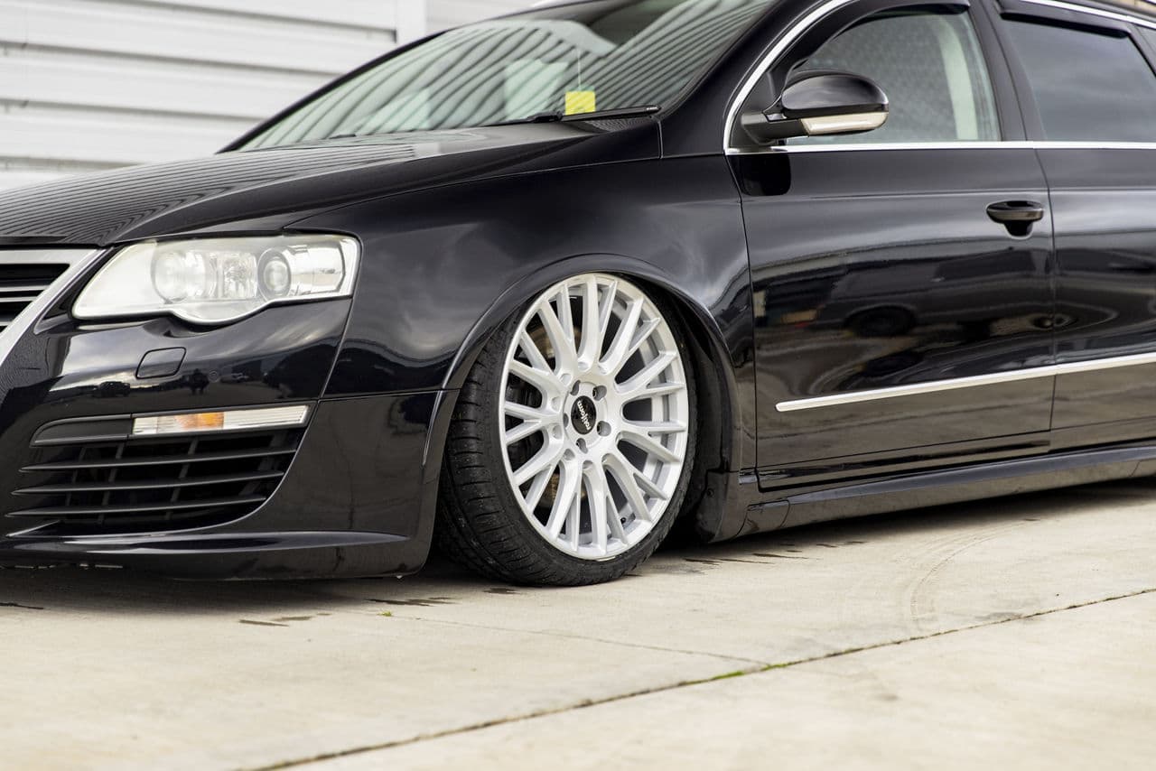 Side profile of 2009 Volkswagen Passat with tuner wheels