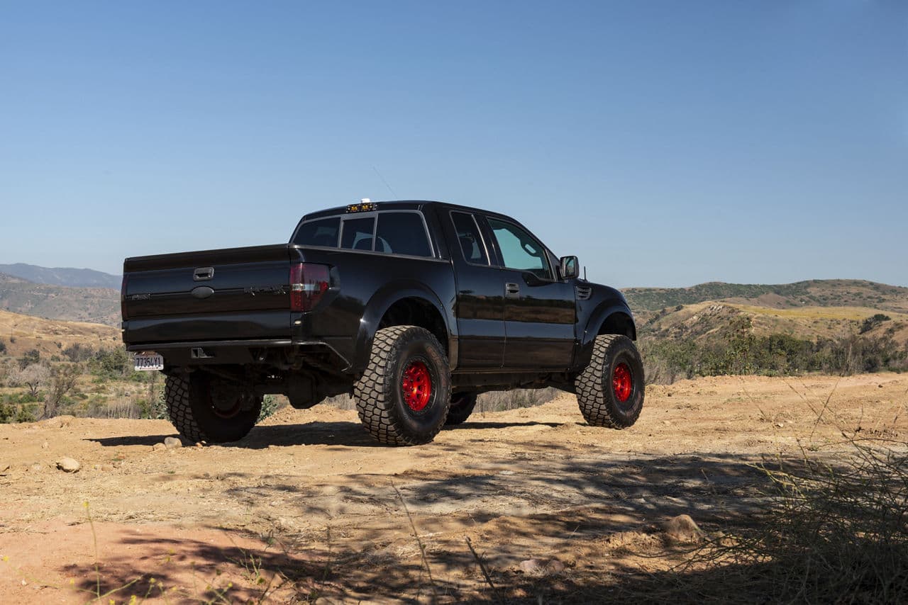 Side profile of 2011 Ford F150 Raptor with vehicle wraps