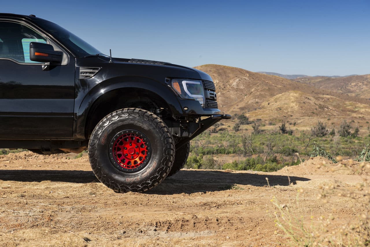 Rear view of 2011 Ford F150 Raptor with vehicle wraps
