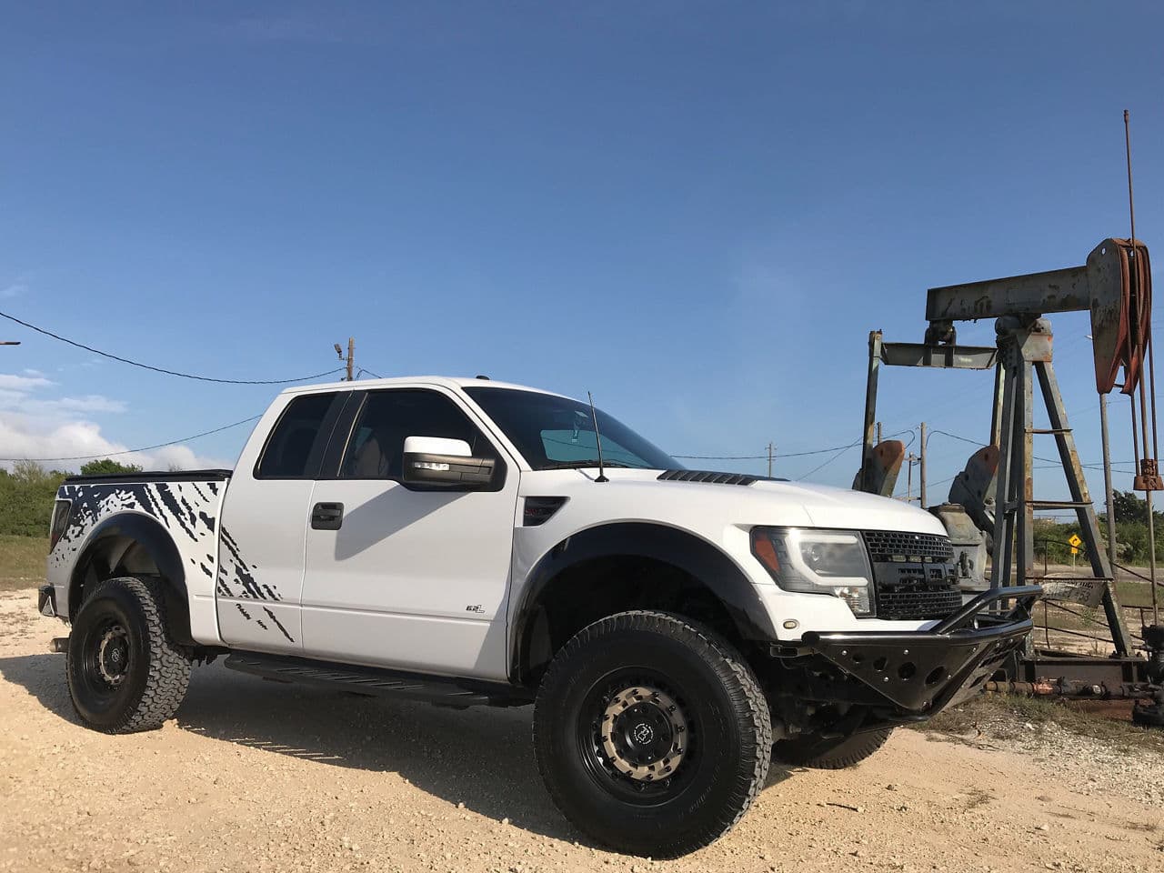 Side profile of 2012 Ford F150 Raptor with truck suv wheels