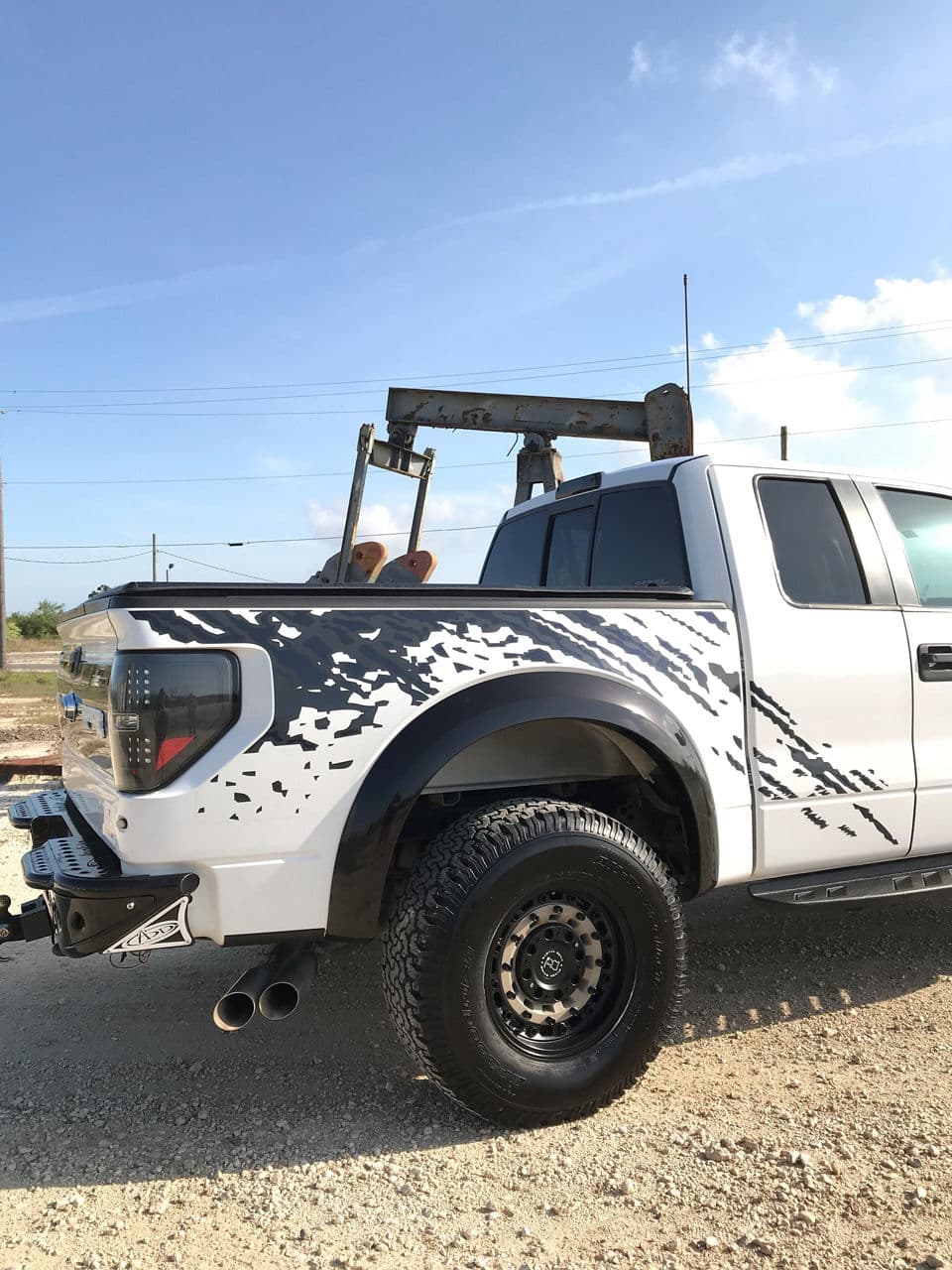 Rear view of 2012 Ford F150 Raptor with truck suv wheels
