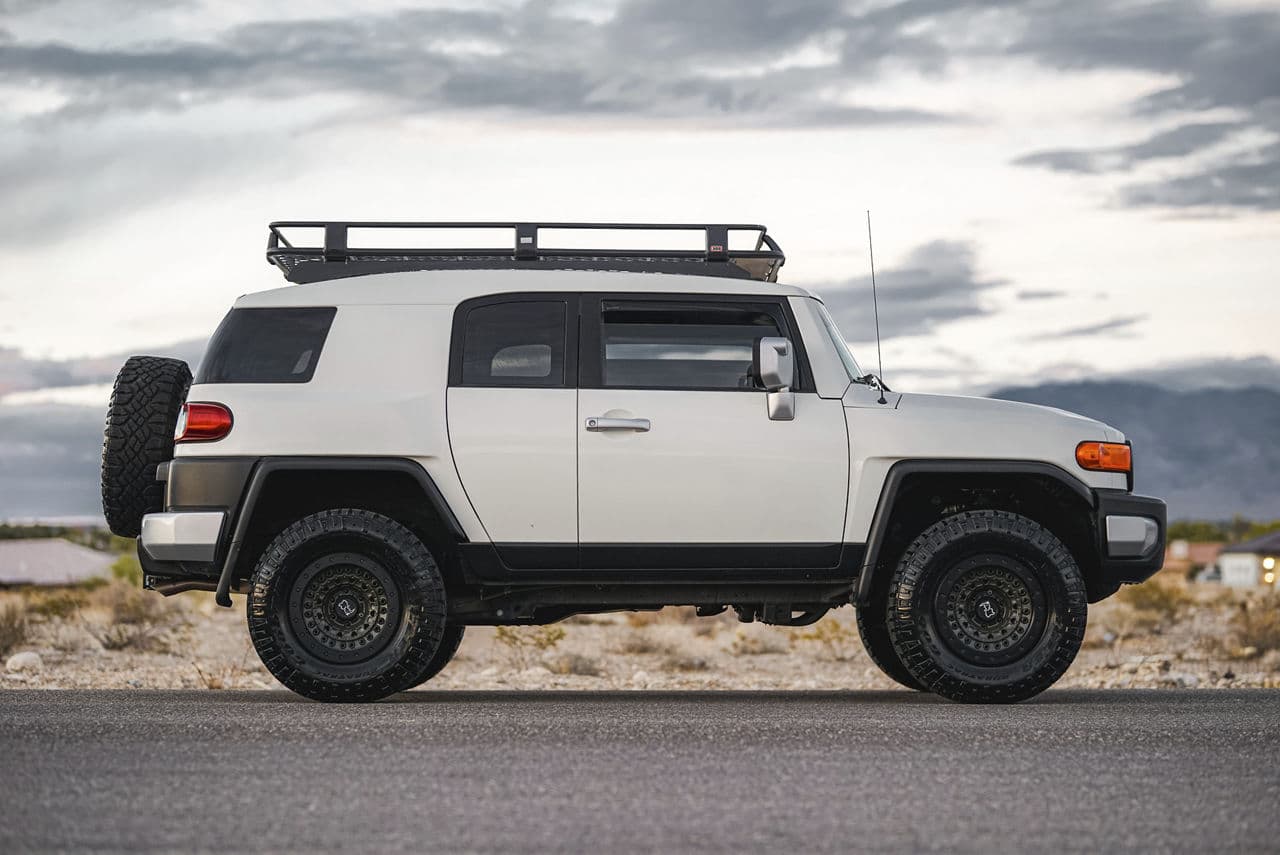 Side profile of 2012 Toyota FJ Cruiser with wheels