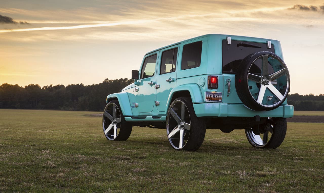 Side profile of 2013 Jeep Wrangler with truck suv wheels