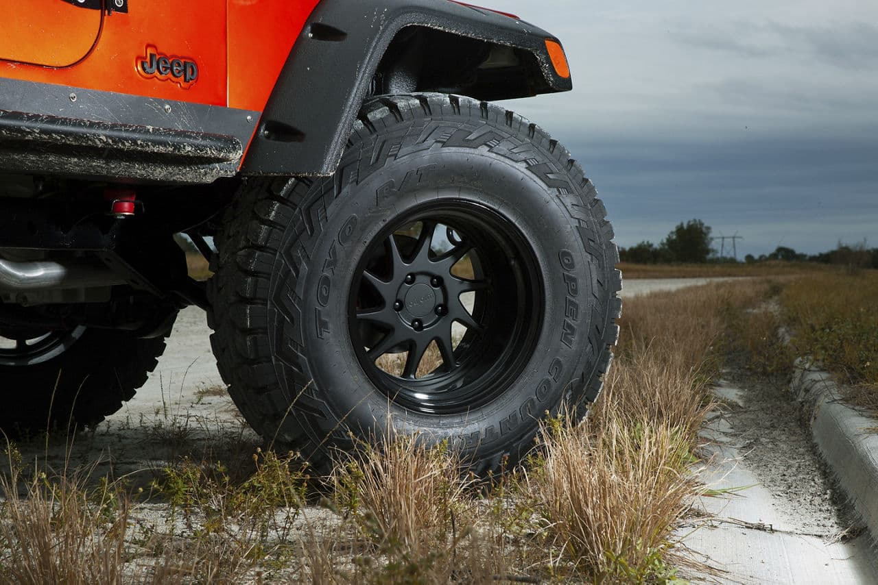Side profile of 2013 Jeep Wrangler with wheels